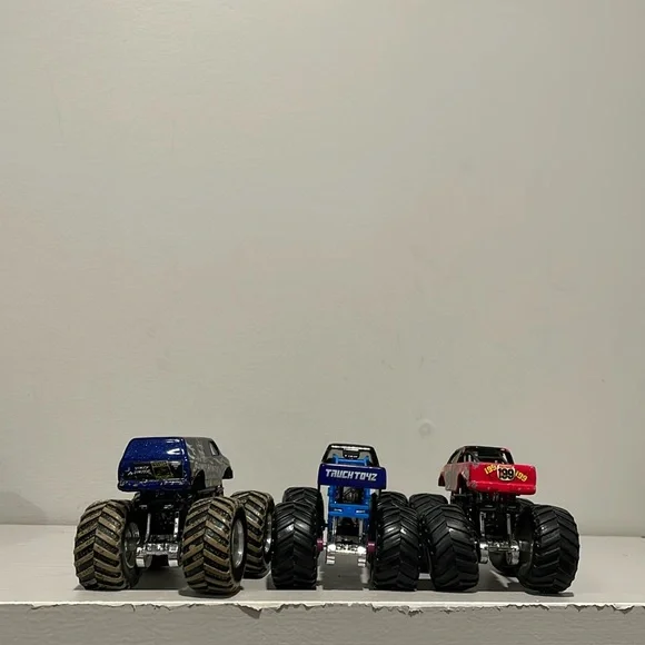 Monster Jam Trucks 1:64 Bounty Hunter, Overall Evolution and HotWheels 199 - Picture 4 of 4